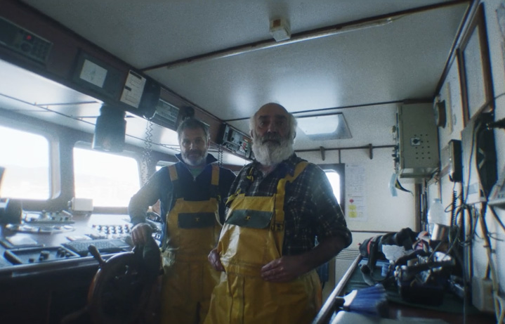 Old fisherman in a boat portrait